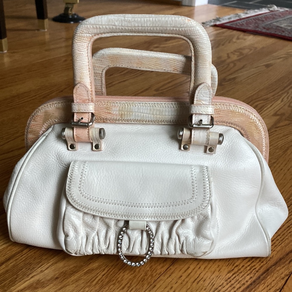White leather purse with salmon colored trim
